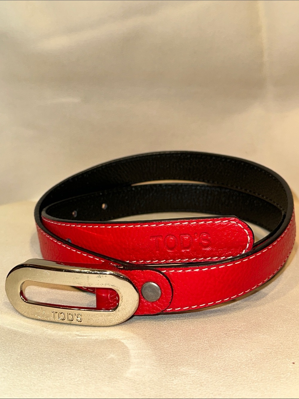 Tod's True Red Leather Belt with Silver Logo Engraved Buckle & White Stitching
